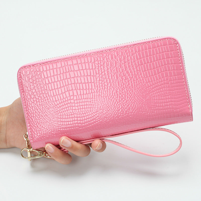 Étui téléphone cuir verni rose avec fermeture éclair et bracelet de poignet Liaisondirecte.com