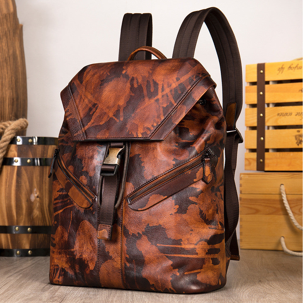 Sac à dos en cuir haut de gamme marron avec motifs élégants et bretelles rembourrées pour voyage